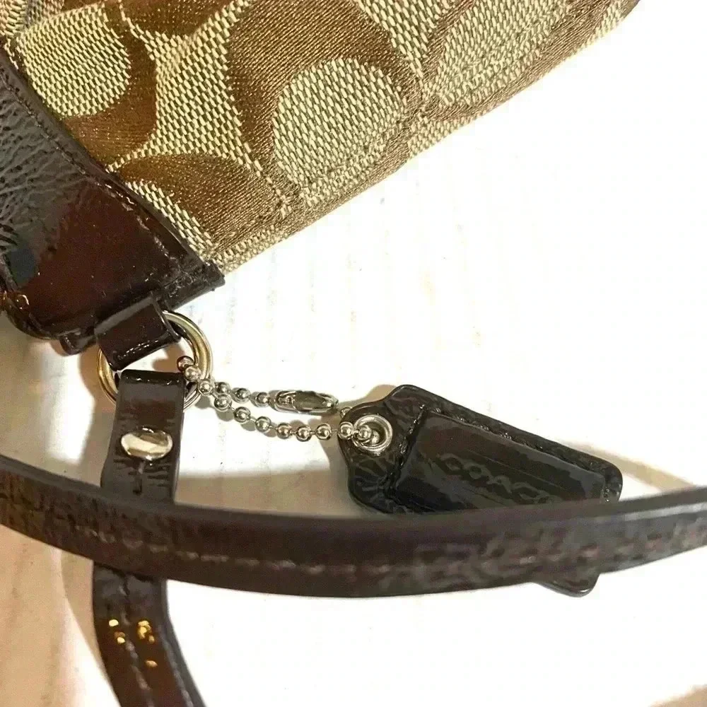 Coach CC signature print canvas wristlet